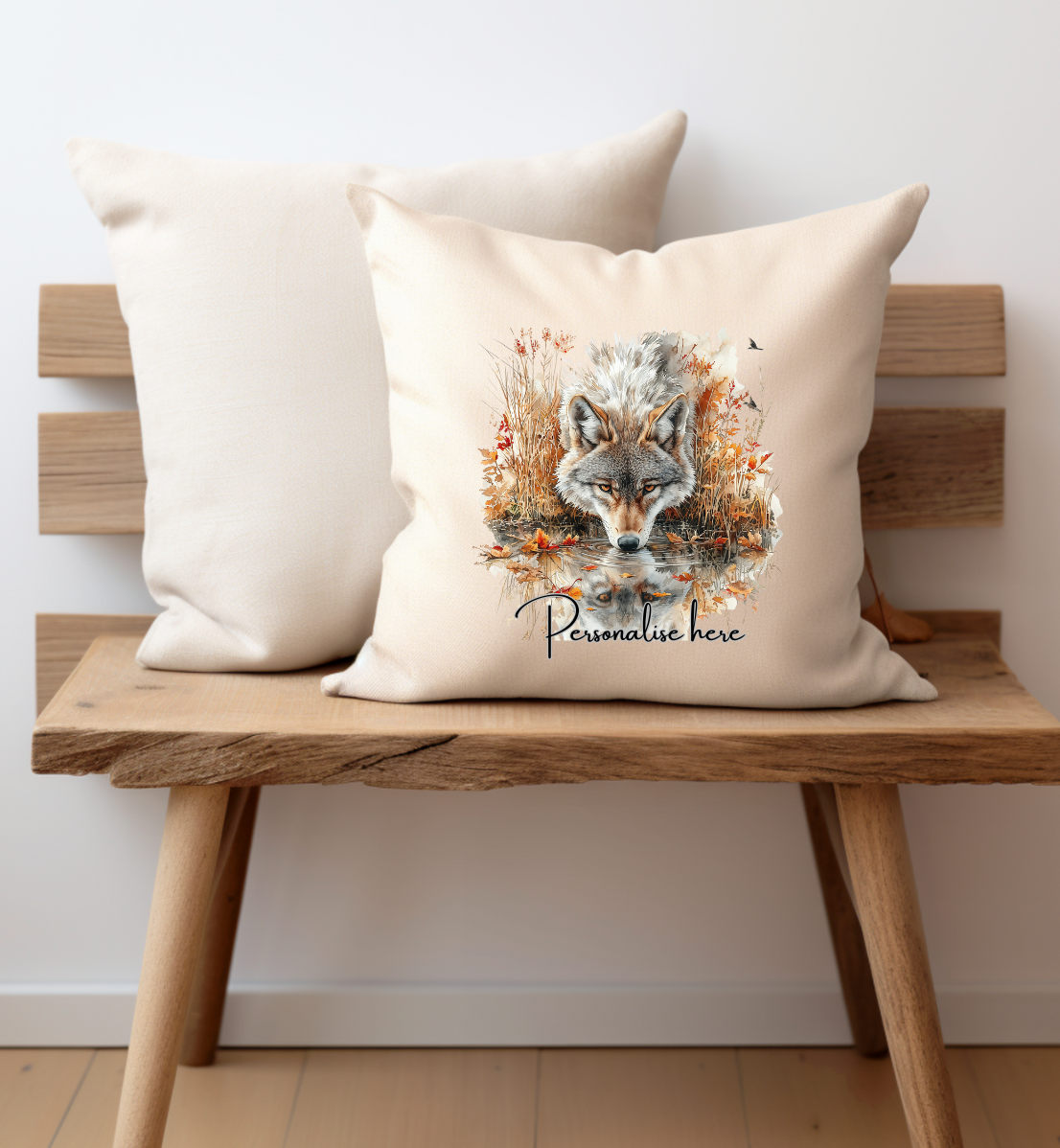 wild wolf running through autumn leaves printed on one side of a cream cushion cover and personalised with a name 