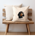 a black and tan cavalier king charles dog printed onto a cream cushion cover on one side and personalised with a name