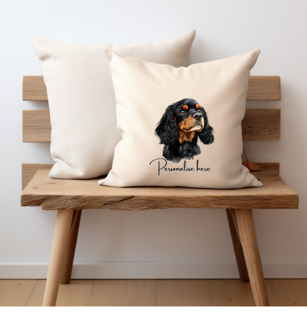 a black and tan cavalier king charles dog printed onto a cream cushion cover on one side and personalised with a name
