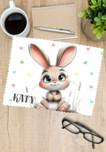 a cute cartoon bunny rinted on one side of a glasses cleaner and personalised with a name