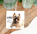 Square Air Freshener with a Cairn Terrier dog and 'LOVE Cairn Terriers' text printed on both sides decorated with a random coloured ribbon