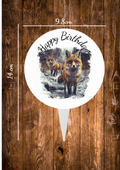 A Aluminium Cake Topper with the design on one side and a silver smooth back ,the text says happy birthday and shows some wild foxes on