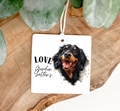 A square air freshener for hanging in your car ,printed both sides with a gordon setter dog and the text love gordon setters