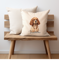 A ruby king Charles cavalier dog printed onto one side of a cream cushion cover with a personalised name